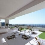 An apartment in Malaga with a balcony overlooking the ocean.