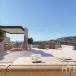 A 3d rendering of a terrace with furniture in an apartment in Malaga and a view of the mountains.