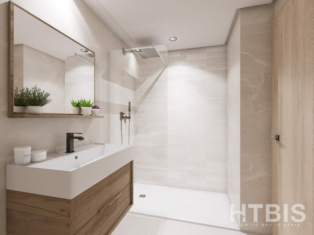 A modern bathroom in an apartment in Malaga with white walls and wooden floors.