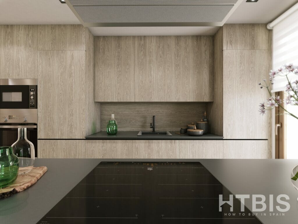 A modern apartment kitchen in Malaga with wooden cabinets and counter tops.