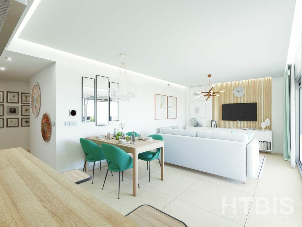 A living room with green chairs and a TV in a Fuengirola New Build apartment.