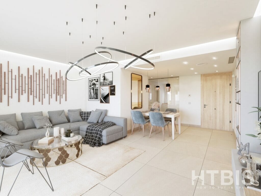 A modern living room in a Marbella New Build apartment with a grey couch and dining table.
