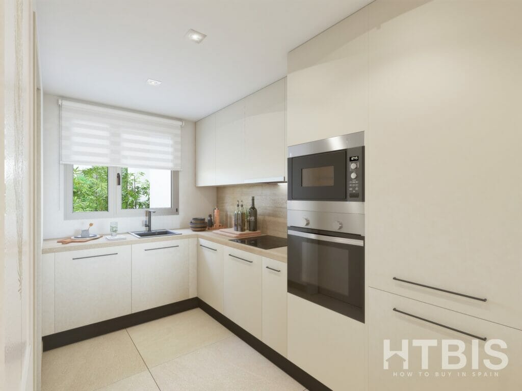 A Malaga New Build Apartment kitchen with white cabinets and a microwave oven.