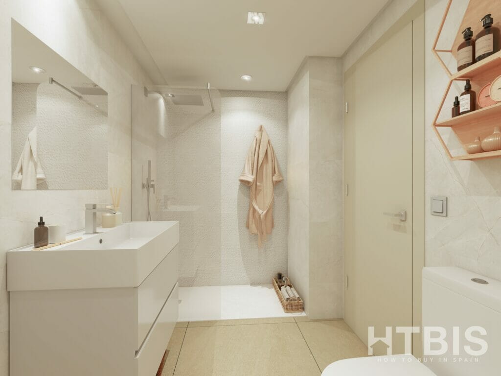 A bathroom with a sink, toilet, and shower in a Fuengirola New Build apartment.