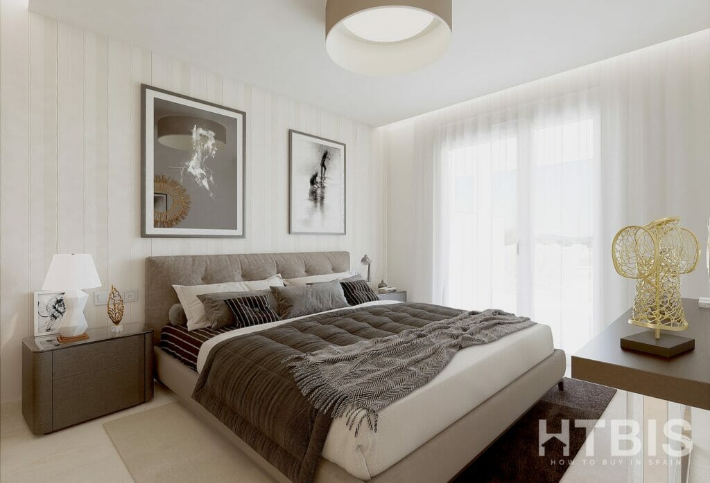 A bedroom with a bed and a bedside table in a Marbella New Build apartment.