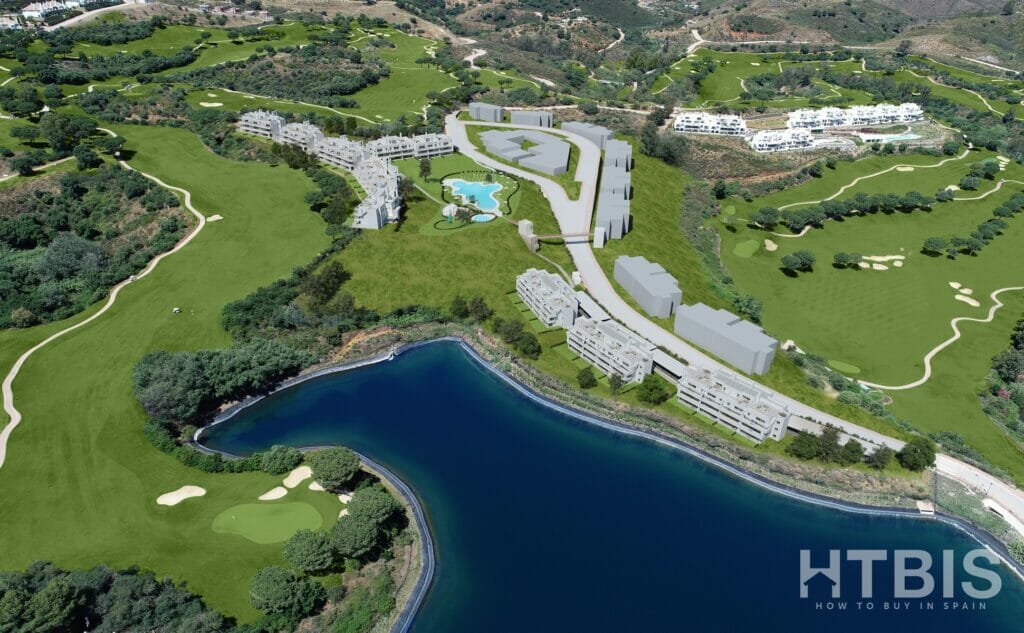 An aerial view of a golf course, a lake, and a new build apartment in Mijas.