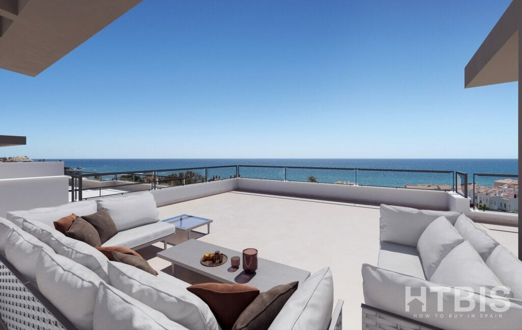 An apartment in Estepona with a balcony overlooking the ocean.