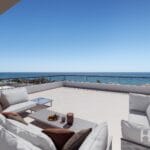 An apartment in Estepona with a balcony overlooking the ocean.