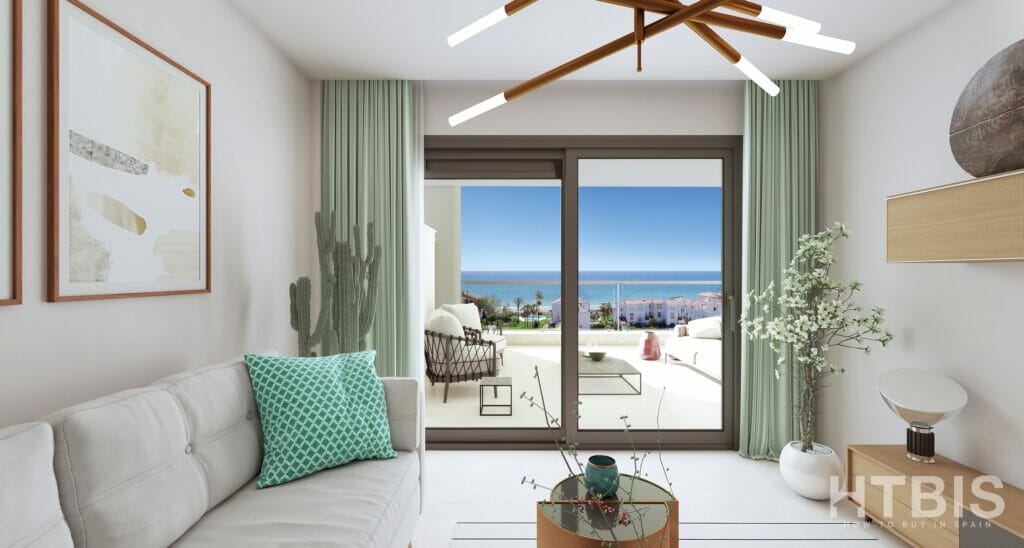 A living room in an apartment with a view of the ocean and the Estepona golf course.