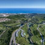 An aerial view of Estepona Golf Course near the ocean.