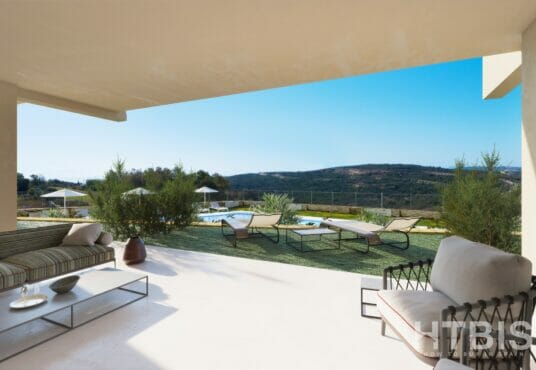 A large patio with furniture and a view of the Estepona mountains.