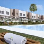 A rendering of a townhouse complex with a swimming pool and lounge chairs.