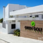 The entrance to a townhouse with the word "Green Golf" on it.