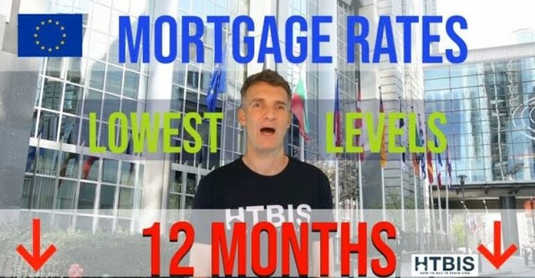 A person stands before a sleek building with a sign proclaiming "Mortgage Rates Lowest Levels 12 Months," accompanied by arrows pointing downward, reflecting the promising landscape for Spanish mortgage rates for non-residents.